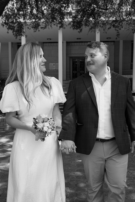 Newlywed couple walking out of the Conroe courthouse, captured by a Houston Elopement photographer.