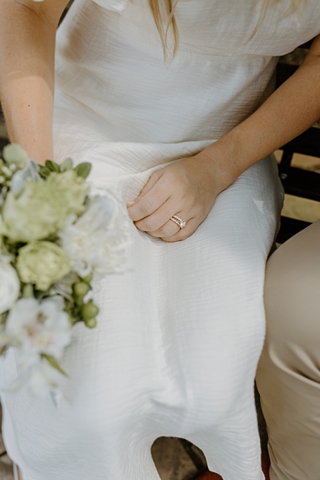 Close up of bride’s engagement ring and wedding band captured in Montgomery County