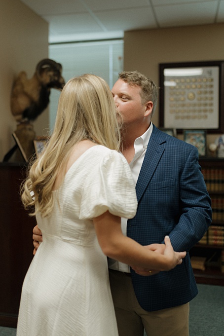 First kiss as newlyweds at the Montgomery Courthouse captured by Houston Elopement Photographer
