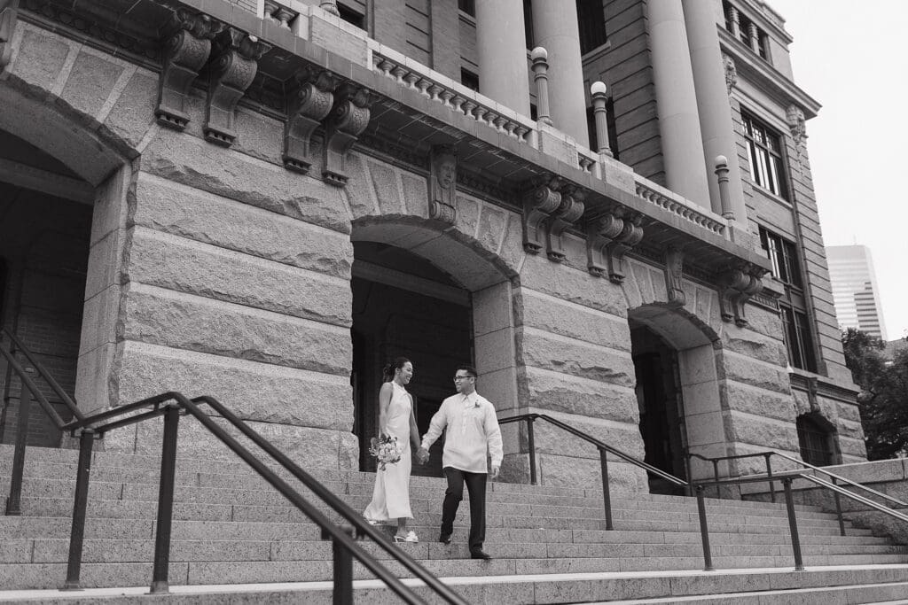 couple on the steps eloping in houston captured by houston elopement photographer 